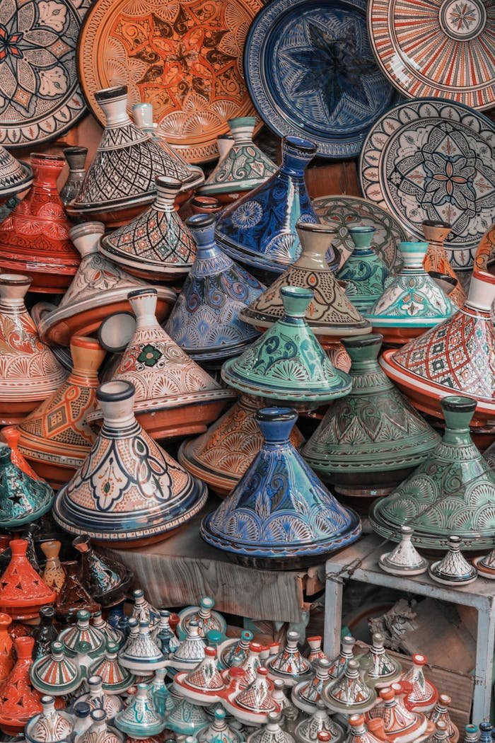 our-services-3 Colorful Moroccan tagine pots artfully stacked, showcasing traditional craftsmanship.